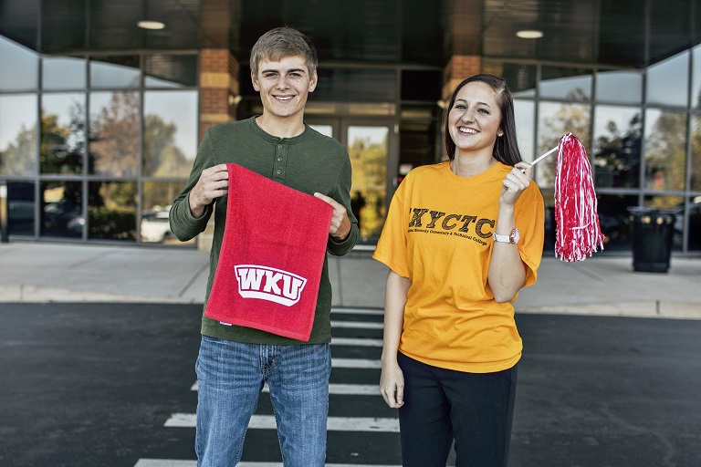 Guy and girl holding WKU towel and pom pom