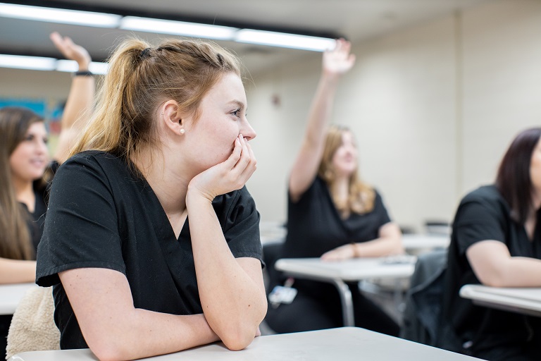 Nursing students sitting in a classroom. 