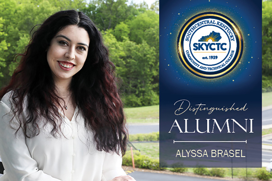 Distinguished Alumni Alyssa Brasel with college crest