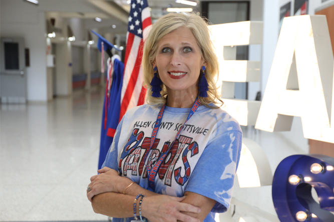 Laura Carter standing in front of Allen Co. High School Sign