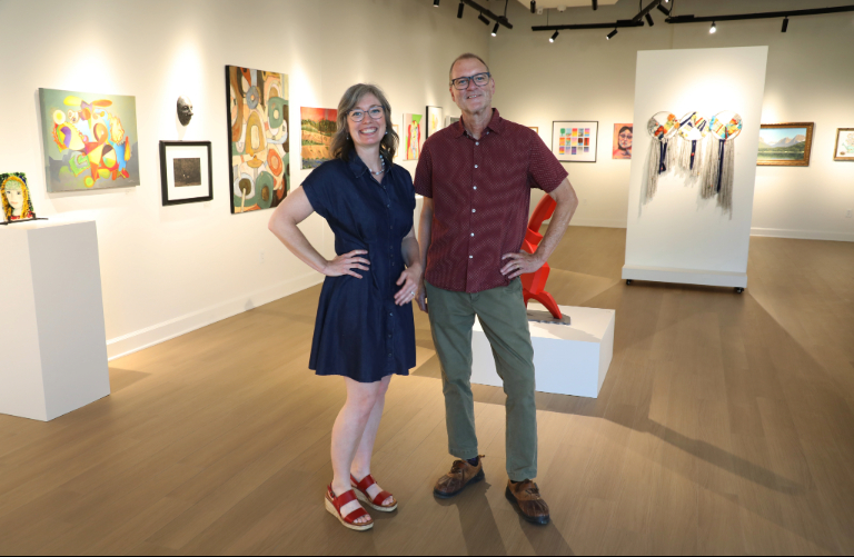 David Jones and Leslie standing in the art gallary.