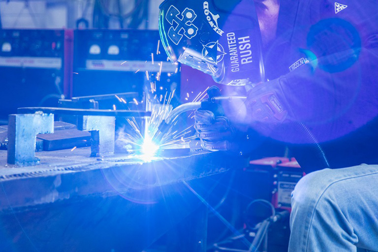 Student practicing welding. 