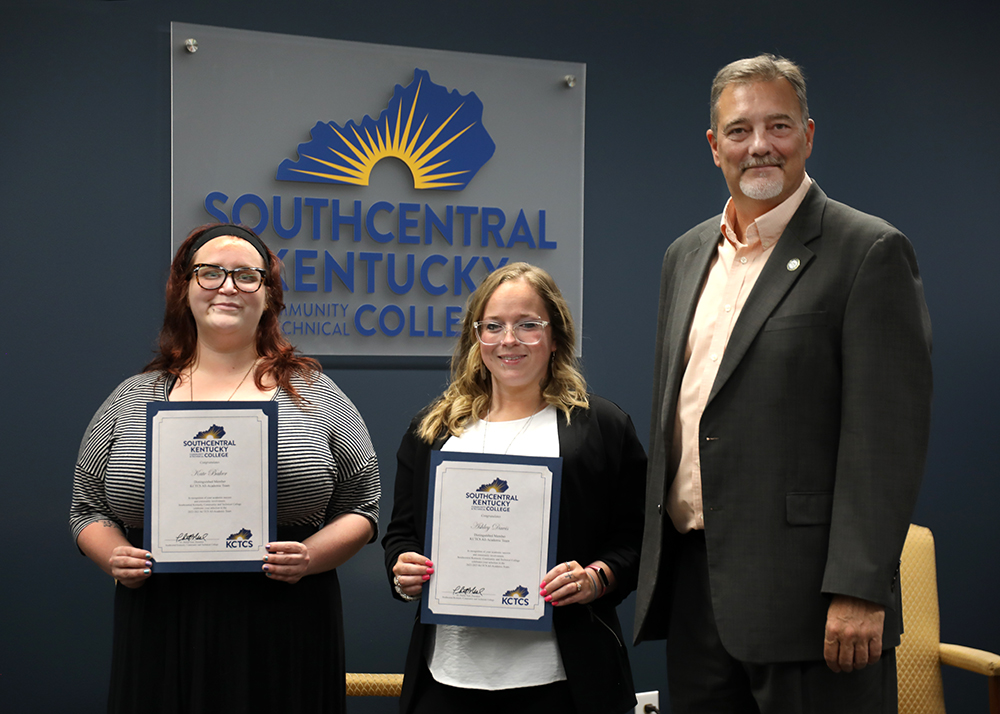 photo of Kate Baker and Ashley Davis with SKYCTC President Dr. Phillip Neal