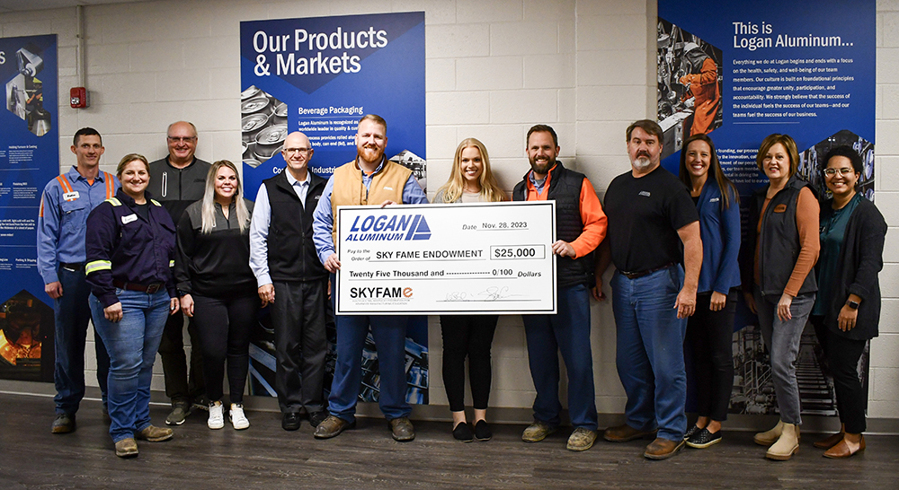 Group of people holding an oversized check for a check presentation