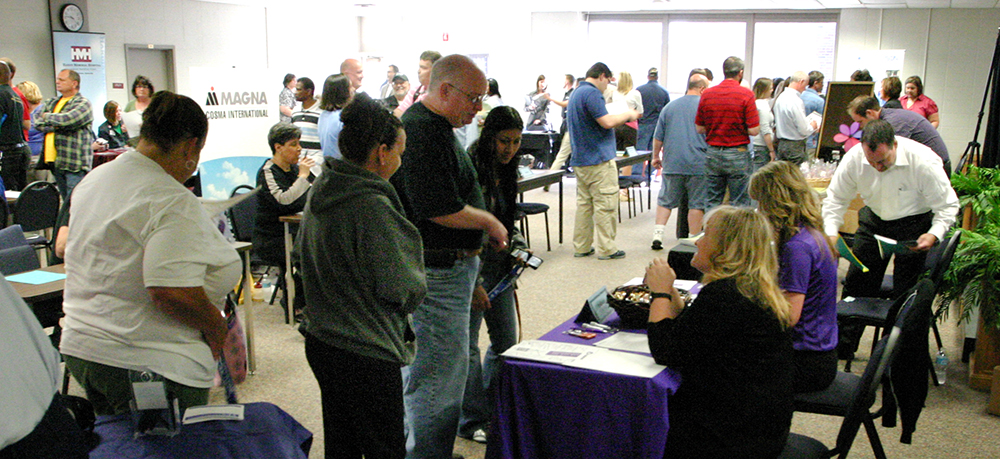 people at career fair talking to employers