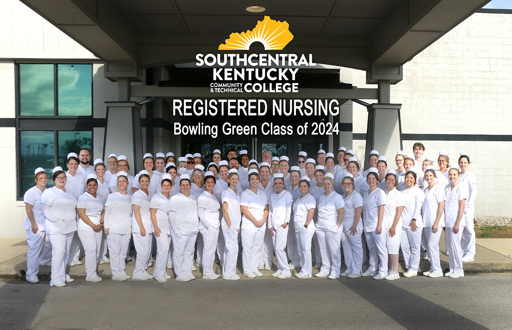 Full group of sixty RN graduates posing for a photo