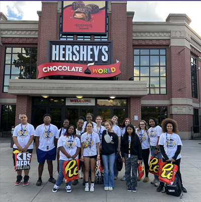 Group of Upward Bound Math and Science students in front of Hersey's factory.