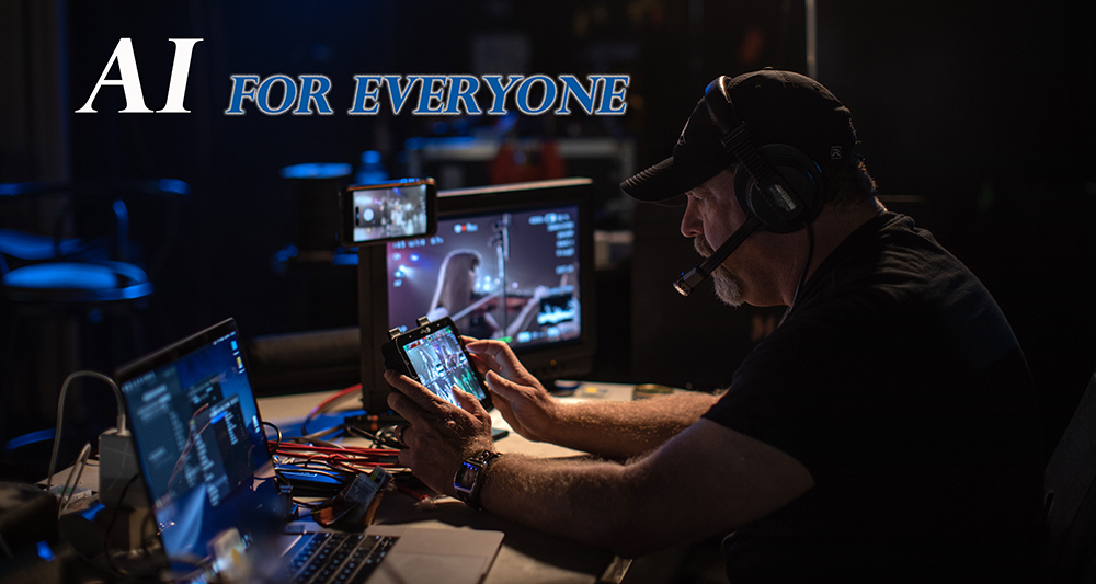 Man with headset on working at several computers with words: Ai for Everyone