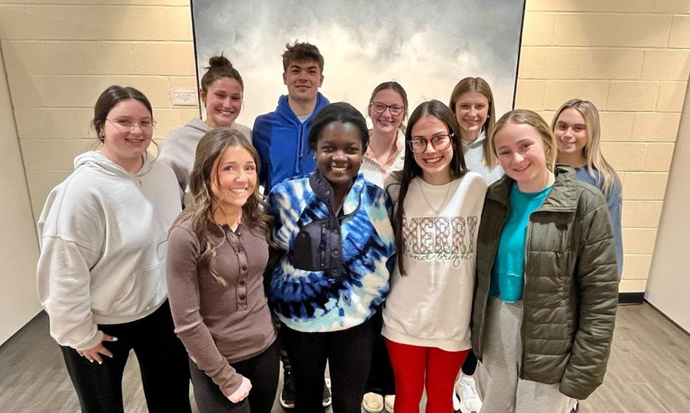Ten hish school students looking at the camera