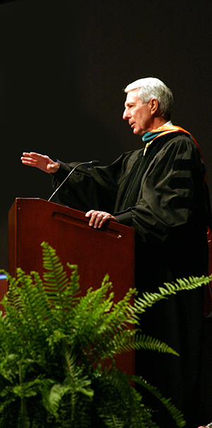 Image of Dr. HOdges speaking at a commencement story