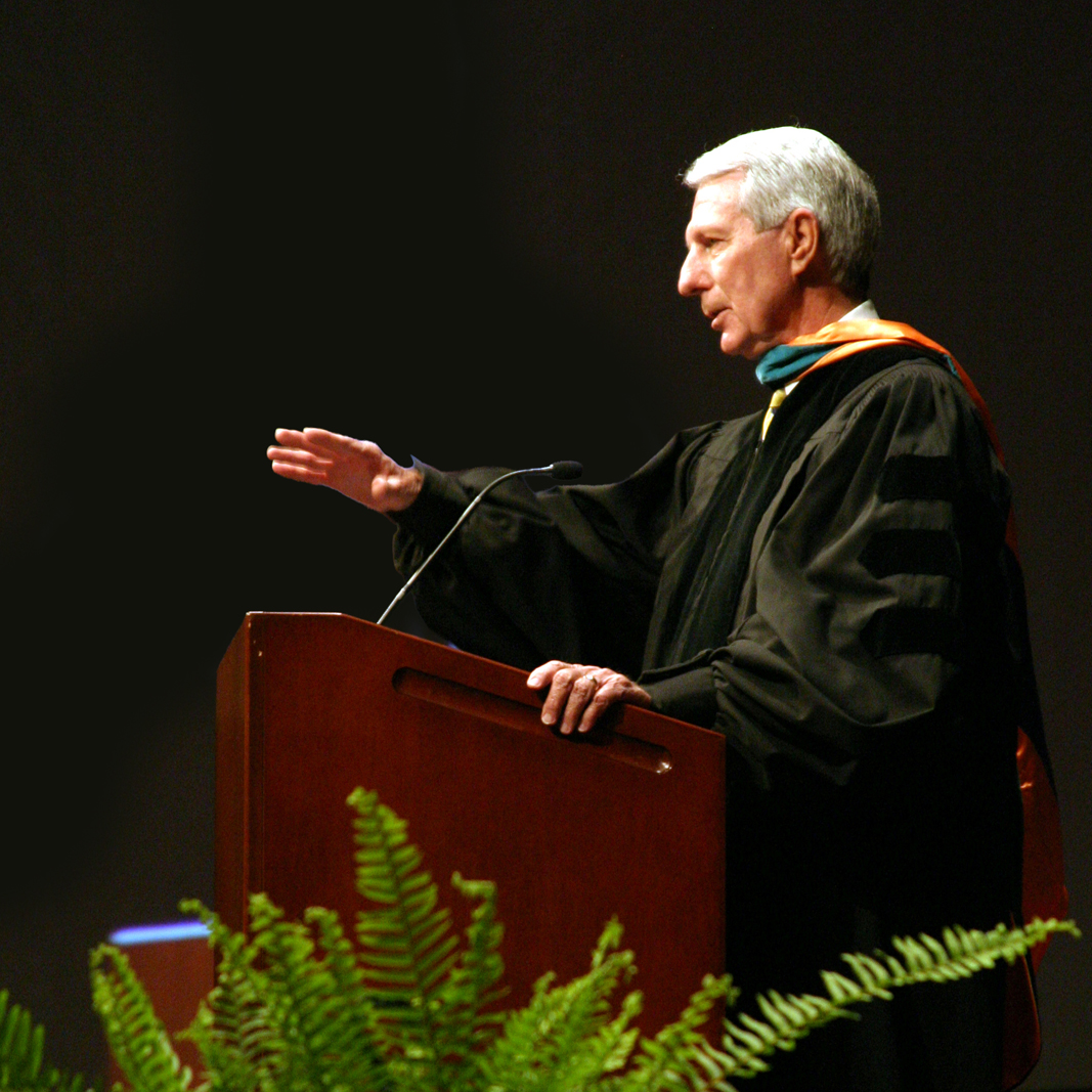 Image of Dr. Nathan Hodges speaking at a commencement ceremony.