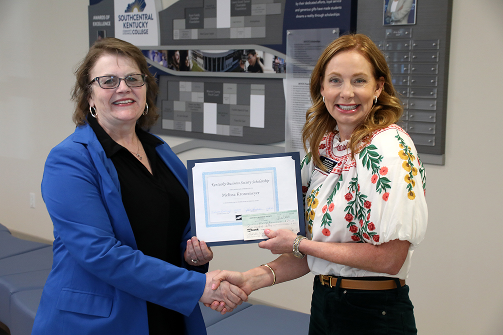Melissa Kronemeyer is presented KBS scholarsip by April Harris