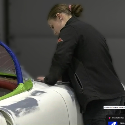 Summer Votaw working on a corvette