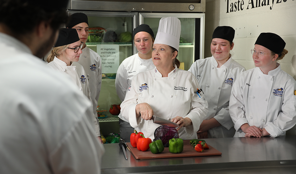 Chef Tammy Inscoe instructing her students in the culinary lab