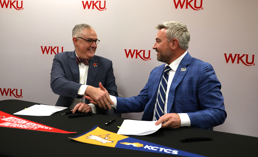 WKU President Timothy C. Caboni and KCTCS President Ryan Quarles shaking hands