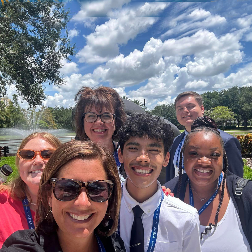 Group of students and advisors outside 
