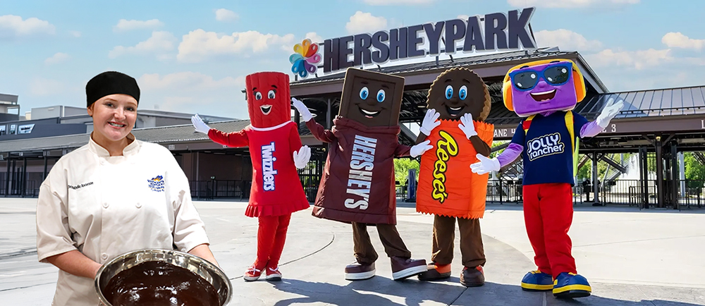 Christabelle Anderson holding a bowl of chocolate with Hershey Park and 4 annimated characters in background