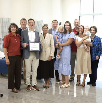 Group of people presenting a scholarship endowment to the college chancellor