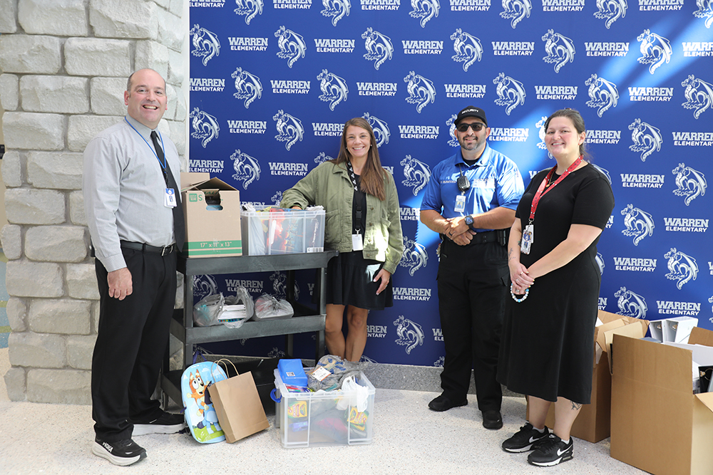 Photo caption: Southcentral Kentucky Community and Technical College delivered school supplies to Warren Elementary School as part of the Stuff the Bus program. Pictured from left: Josh Porter (Principal Warren Elementary), Megan Skaggs (Family Resource Coordinator Warren Elementary), Halid Muratovic (SKYCTC Security), and Samantha Yucka (Family Resource Center Assistant).