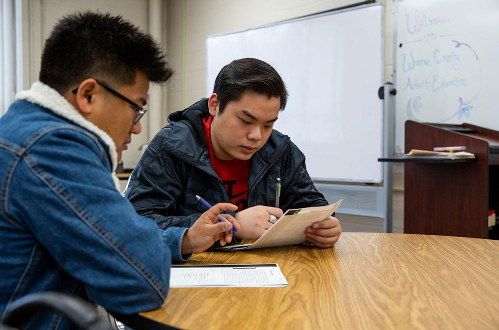 Southcentral Kentucky Community and Technical College Ged students James Thang and Quang Le work on a reading assignment in GED Teacher Debbie Fox’s advanced language arts class at SKYCTC on Thursday, Jan 9, 2020. Earlier this week, the Brashear administration announced it will be waiving testing fees for Kentuckians seeking to earn a Ged. (Grace Ramey/photo@bgdailynews.com)