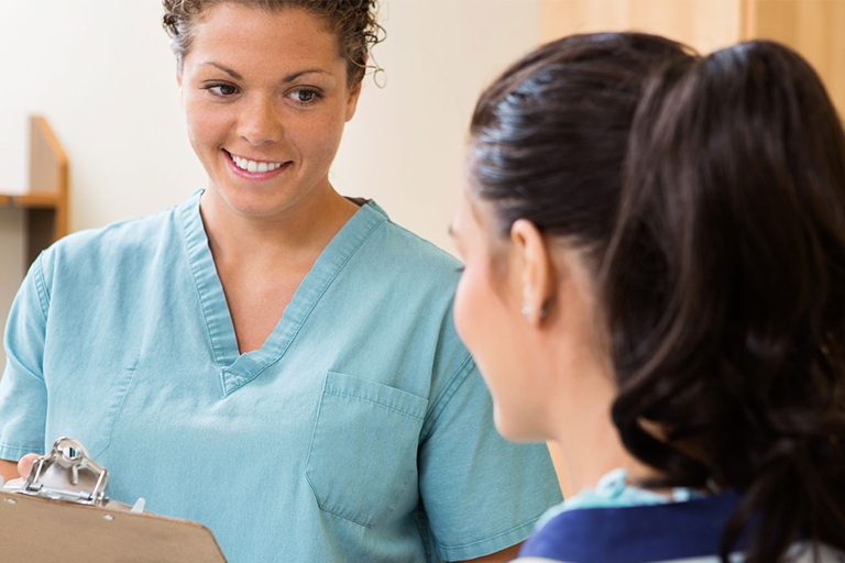 Medical Assitant talking to a patient